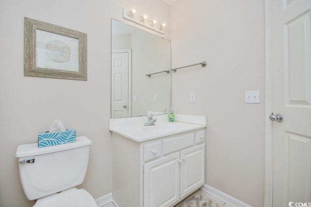 404 1st Ave N Unit H, North Myrtle Beach, SC 29582 - half bath featuring vanity, toilet, and baseboards