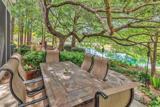 67 Camden Cir, Pawleys Island, SC 29585 - view of patio featuring outdoor dining area and a water view