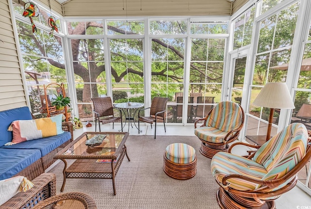 sunroom featuring an outdoor hangout area