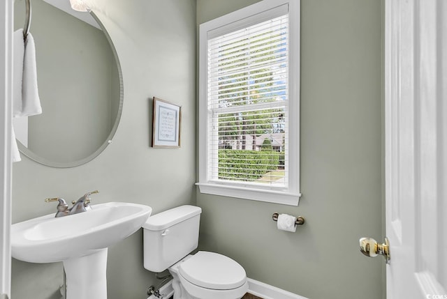 67 Camden Cir, Pawleys Island, SC 29585 - half bathroom with toilet, baseboards, and a sink