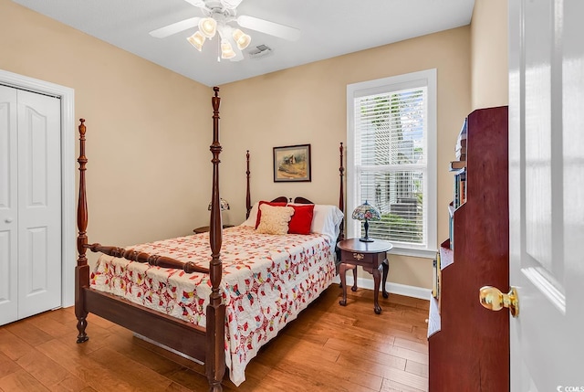 67 Camden Cir, Pawleys Island, SC 29585 - bedroom with hardwood / wood-style flooring, a ceiling fan, baseboards, and a closet
