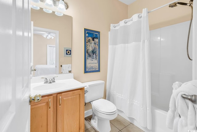 full bathroom featuring tile patterned floors, toilet, vanity, and shower / bathtub combination with curtain