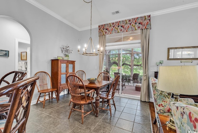 67 Camden Cir, Pawleys Island, SC 29585 - dining area with a chandelier, crown molding, arched walkways, baseboards, and tile patterned flooring