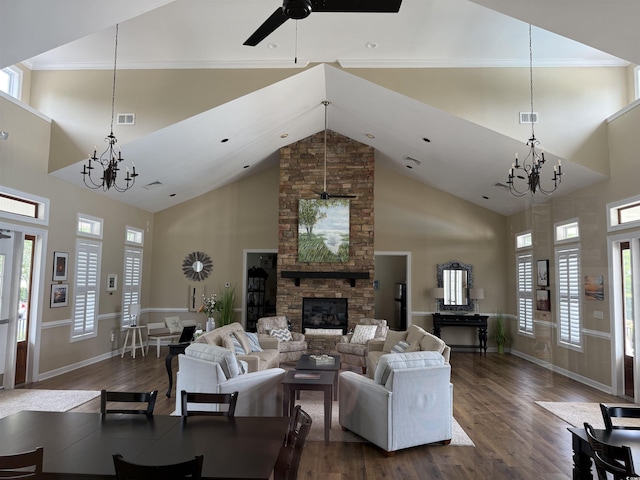 67 Camden Cir, Pawleys Island, SC 29585 - living room featuring a chandelier, dark wood-style floors, high vaulted ceiling, a stone fireplace, and ceiling fan
