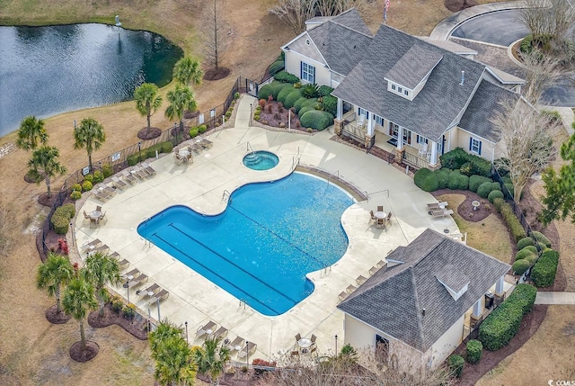 67 Camden Cir, Pawleys Island, SC 29585 - community pool featuring a fenced backyard, a hot tub, a patio, and a water view