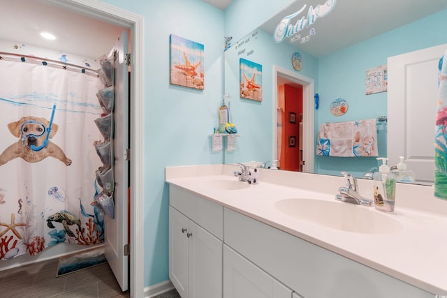 348 Hidden Cove Dr, Little River, SC 29566 - bathroom with double vanity and a shower with shower curtain