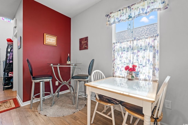 348 Hidden Cove Dr, Little River, SC 29566 - dining room with light wood-style flooring and baseboards