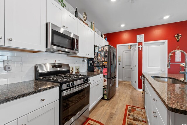 348 Hidden Cove Dr, Little River, SC 29566 - kitchen with stainless steel appliances, a sink, white cabinets, and recessed lighting