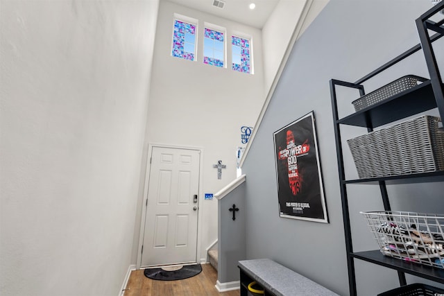 348 Hidden Cove Dr, Little River, SC 29566 - mudroom featuring wood finished floors, baseboards, and a towering ceiling