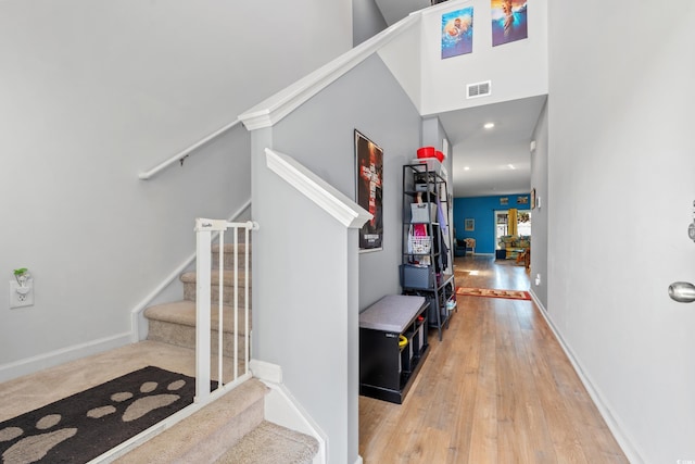 348 Hidden Cove Dr, Little River, SC 29566 - hall with stairs, wood-type flooring, and baseboards