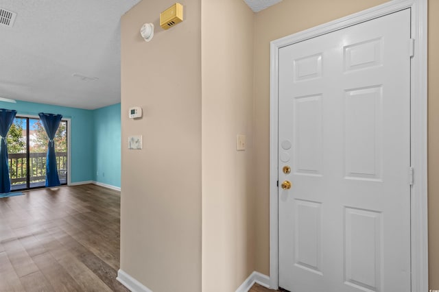 510 Fairwood Lakes Dr Unit 19-Q, Myrtle Beach, SC 29588 - entryway with baseboards, wood finished floors, and a textured ceiling
