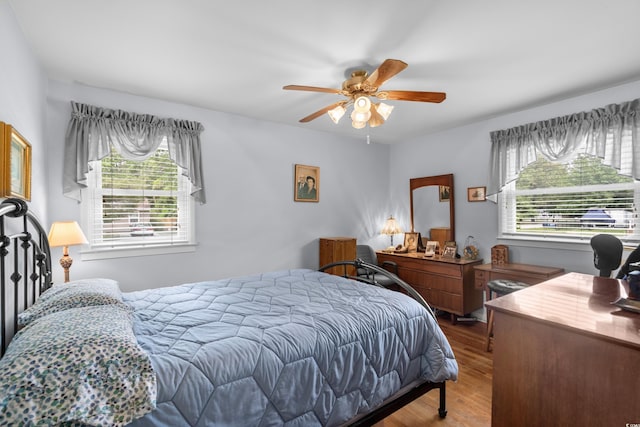 bedroom with wood finished floors and ceiling fan