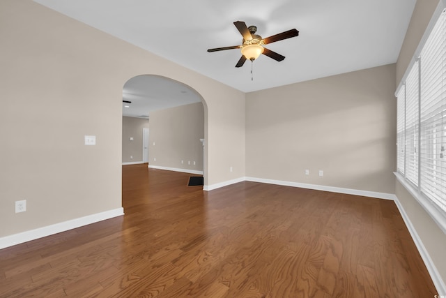 644 Harbor Bay Dr, Murrells Inlet, SC 29576 - spare room featuring ceiling fan, arched walkways, healthy amount of natural light, and wood finished floors