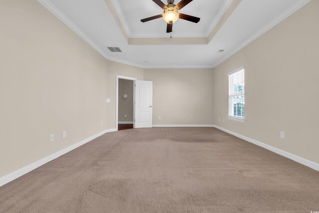 644 Harbor Bay Dr, Murrells Inlet, SC 29576 - carpeted spare room featuring a tray ceiling, crown molding, ceiling fan, and baseboards
