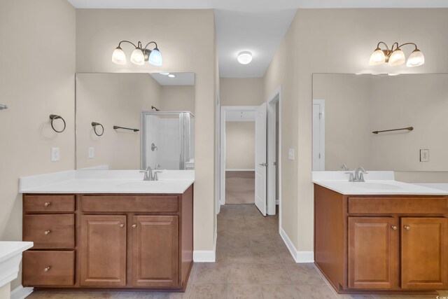 644 Harbor Bay Dr, Murrells Inlet, SC 29576 - full bathroom with a stall shower, two vanities, tile patterned flooring, and baseboards