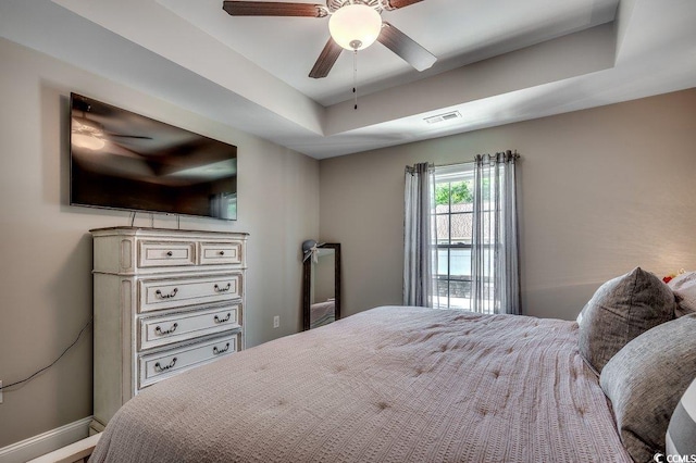 bedroom featuring a ceiling fan and baseboards
