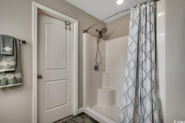 full bath with a shower with curtain