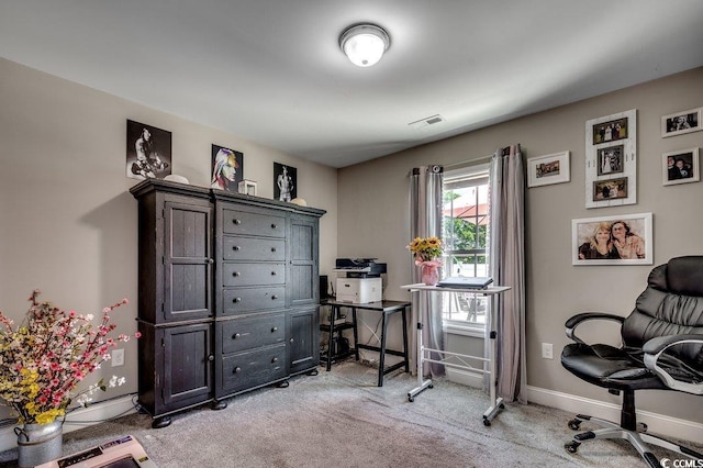 office area with light colored carpet and baseboards