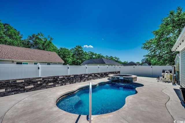 view of pool featuring a fenced backyard, a patio, and a pool with connected hot tub