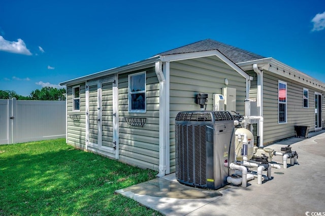view of side of property featuring central AC unit