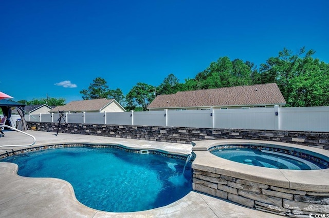 view of swimming pool featuring an in-ground hot tub, a fenced backyard, and a patio