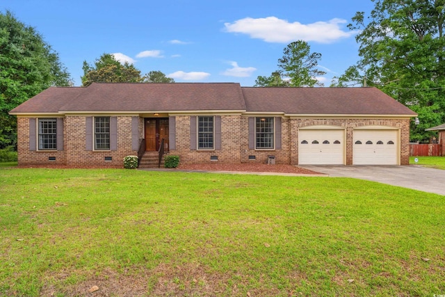 ranch-style home with crawl space, an attached garage, concrete driveway, brick siding, and a front yard