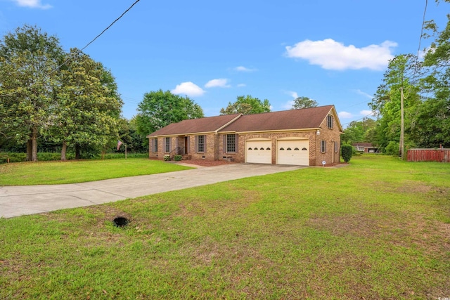 view of front of house featuring an attached garage, driveway, brick siding, and a front yard