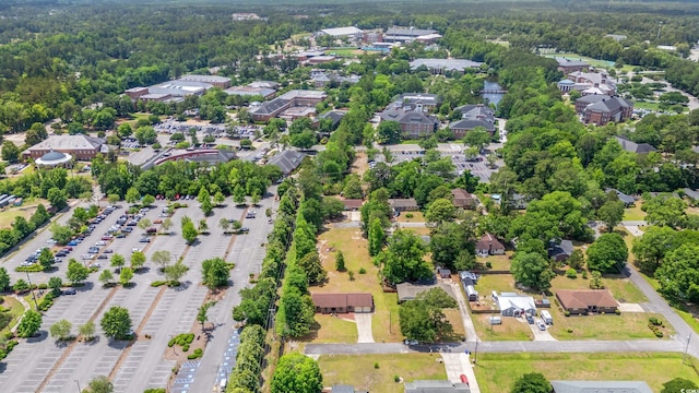 aerial overview of property's location with nearby suburban area