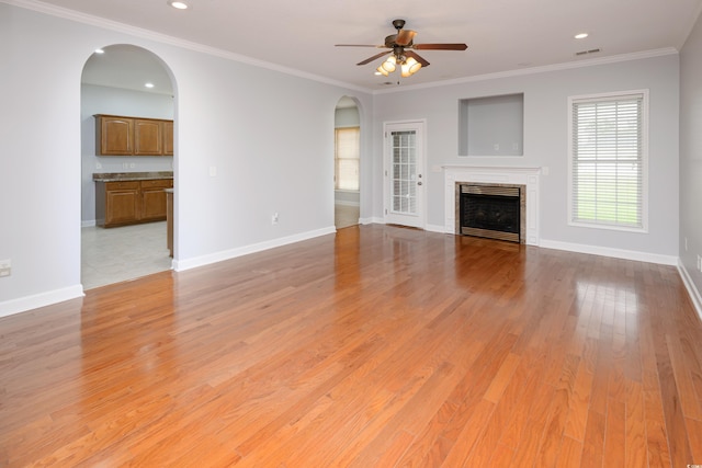 249 Ashepoo Creek Dr, Myrtle Beach, SC 29579 - unfurnished living room featuring arched walkways, ceiling fan, light wood-style floors, a fireplace, and recessed lighting