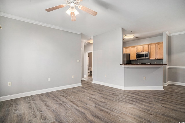 2029 Silvercrest Dr Unit 22B, Myrtle Beach, SC 29579 - kitchen featuring stainless steel microwave, ceiling fan, dark wood-style floors, dark countertops, and crown molding