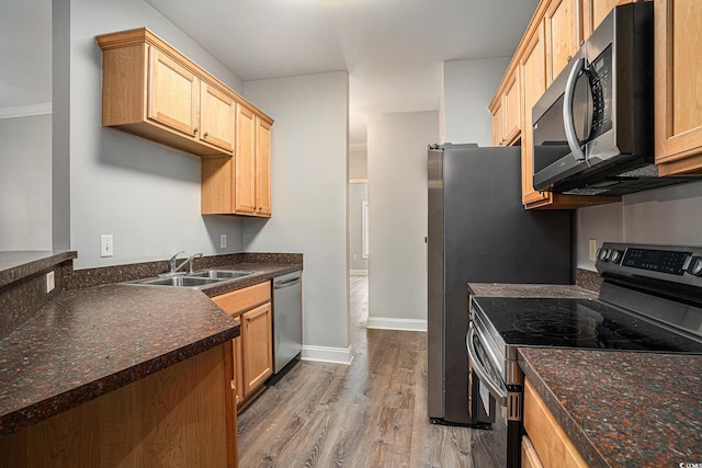 2029 Silvercrest Dr Unit 22B, Myrtle Beach, SC 29579 - kitchen with appliances with stainless steel finishes, a sink, wood finished floors, dark countertops, and baseboards