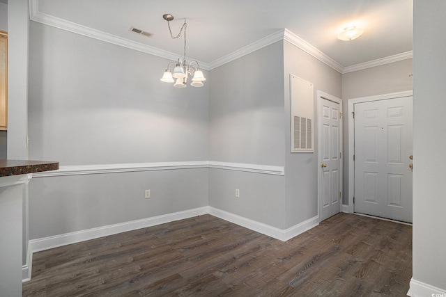 2029 Silvercrest Dr Unit 22B, Myrtle Beach, SC 29579 - unfurnished dining area featuring dark wood-type flooring, ornamental molding, a chandelier, and baseboards