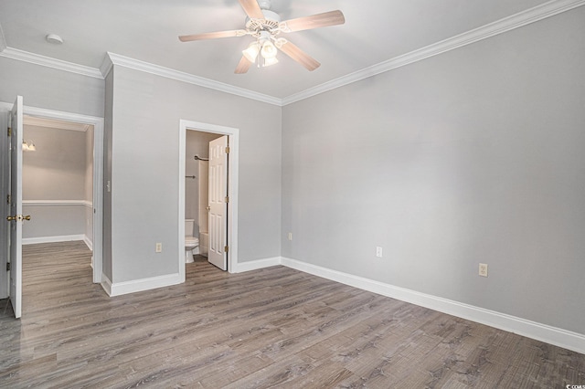 2029 Silvercrest Dr Unit 22B, Myrtle Beach, SC 29579 - unfurnished bedroom with wood finished floors, crown molding, baseboards, a ceiling fan, and ensuite bathroom