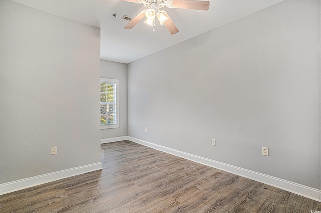 2029 Silvercrest Dr Unit 22B, Myrtle Beach, SC 29579 - empty room with wood finished floors, a ceiling fan, and baseboards