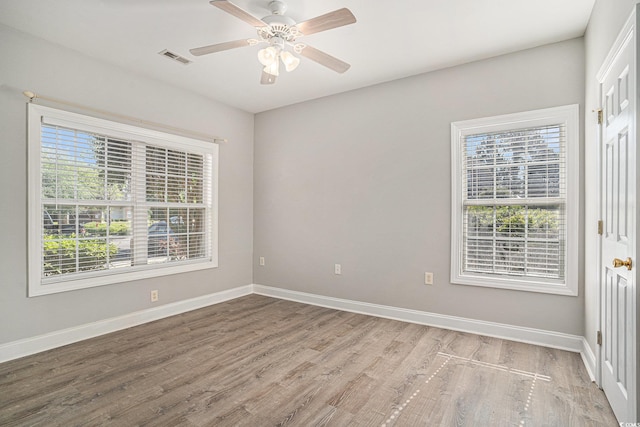 2029 Silvercrest Dr Unit 22B, Myrtle Beach, SC 29579 - spare room with plenty of natural light, wood finished floors, baseboards, and a ceiling fan