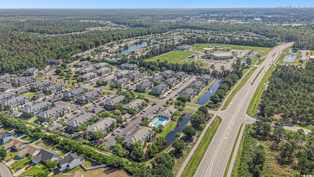 2029 Silvercrest Dr Unit 22B, Myrtle Beach, SC 29579 - aerial view of property and surrounding area with a major roadway, a nearby body of water, nearby suburban area, and a forest