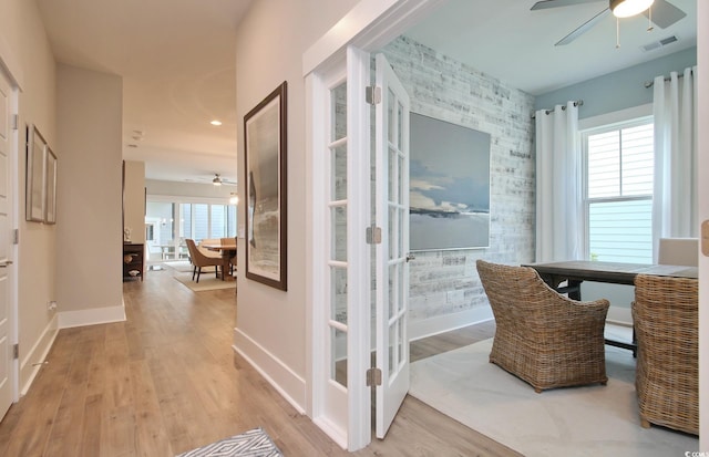 812 Maltby Aly, Myrtle Beach, SC 29588 - corridor with healthy amount of natural light, an accent wall, and wood finished floors