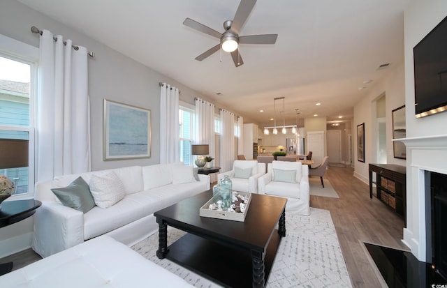 812 Maltby Aly, Myrtle Beach, SC 29588 - living room featuring ceiling fan, light wood-type flooring, recessed lighting, and a fireplace with flush hearth
