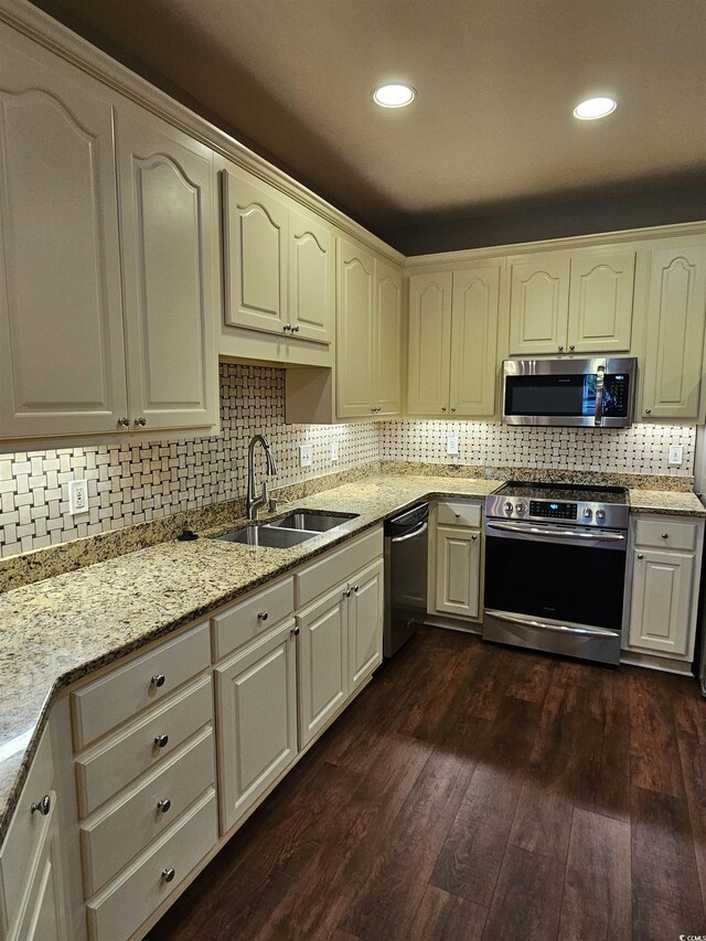 1426 Saint Thomas Cir Unit A 3, Myrtle Beach, SC 29577 - kitchen featuring stainless steel appliances, a sink, dark wood finished floors, decorative backsplash, and recessed lighting