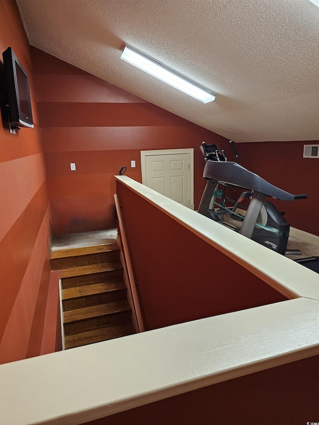 1426 Saint Thomas Cir Unit A 3, Myrtle Beach, SC 29577 - stairs with lofted ceiling and a textured ceiling