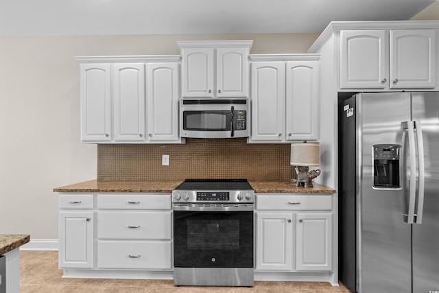 kitchen featuring appliances with stainless steel finishes, stone countertops, white cabinetry, and tasteful backsplash