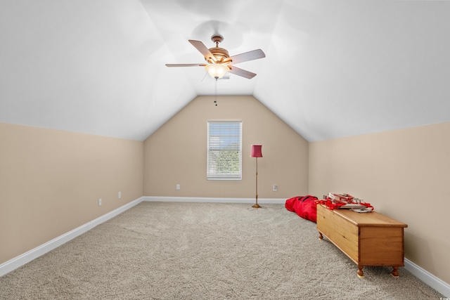 additional living space with carpet, baseboards, and lofted ceiling