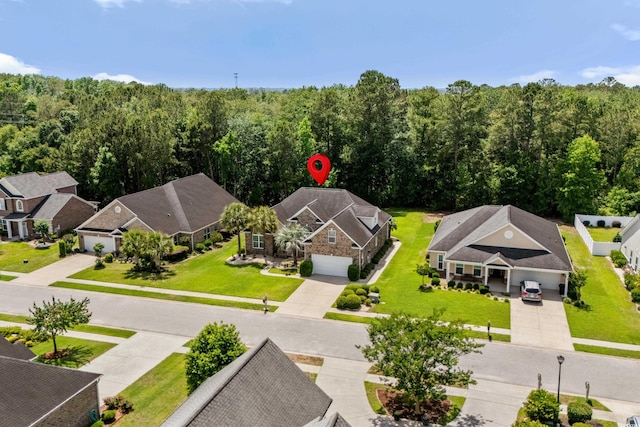 aerial perspective of suburban area featuring a forest