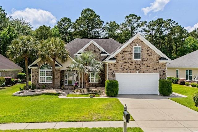 view of front facade featuring brick siding, driveway, a front lawn, and an attached garage