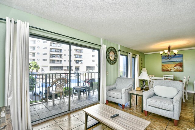 5905 S Kings Hwy Unit 116B, Myrtle Beach, SC 29575 - tiled living area featuring a chandelier and a textured ceiling