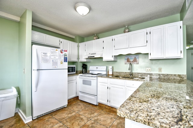 5905 S Kings Hwy Unit 116B, Myrtle Beach, SC 29575 - kitchen with white appliances, under cabinet range hood, a sink, white cabinetry, and a textured ceiling