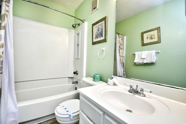 5905 S Kings Hwy Unit 116B, Myrtle Beach, SC 29575 - full bathroom featuring a textured ceiling, toilet, shower / bath combo with shower curtain, and vanity