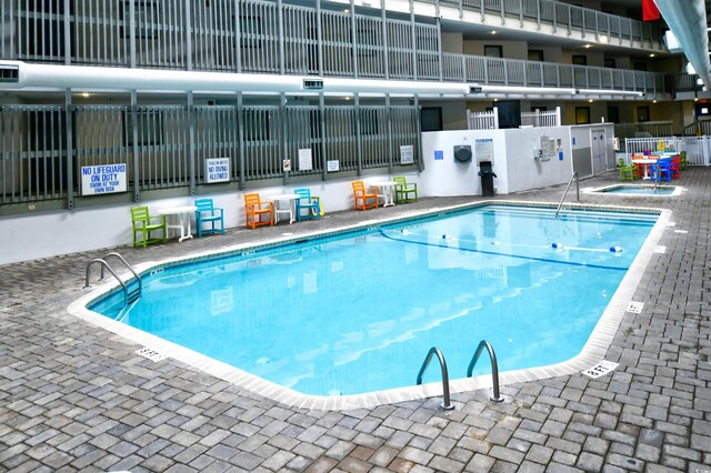 5905 S Kings Hwy Unit 116B, Myrtle Beach, SC 29575 - community pool with a community hot tub and fence