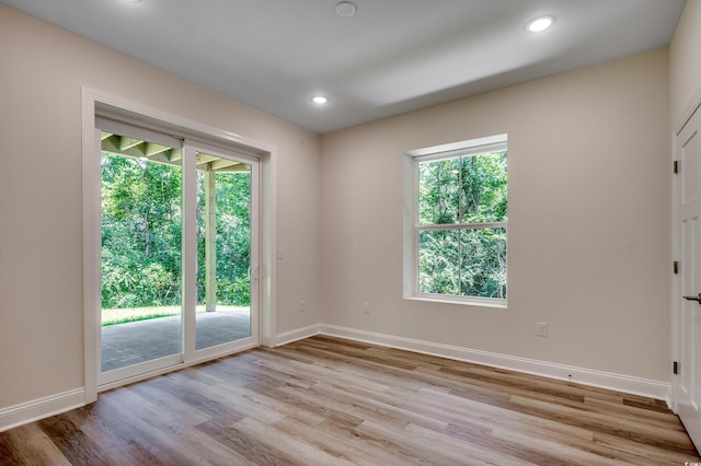 1673 Carriage Ln, Little River, SC 29566 - empty room with light wood-style flooring, plenty of natural light, baseboards, and recessed lighting