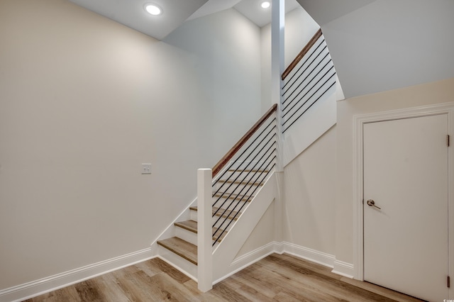 1673 Carriage Ln, Little River, SC 29566 - staircase with wood finished floors, baseboards, and recessed lighting